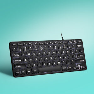 un clavier d'ordinateur noir avec des touches blanches sur fond bleu.